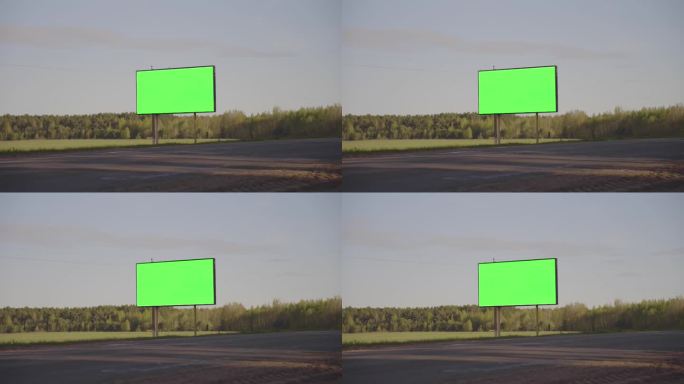 绿色镀铬的广告牌矗立在高速公路的路边