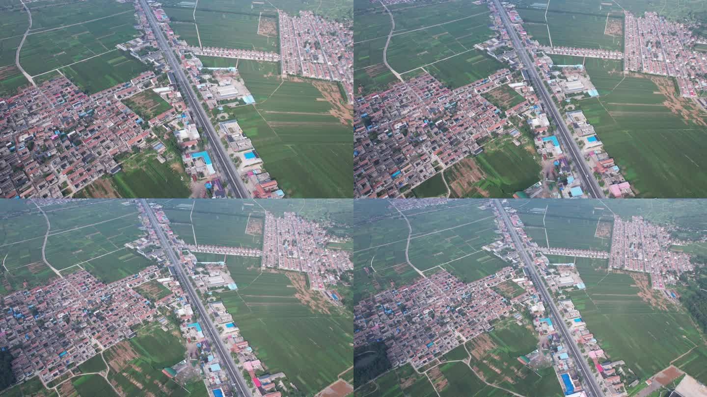 航拍像飞机形状的大地农田村庄