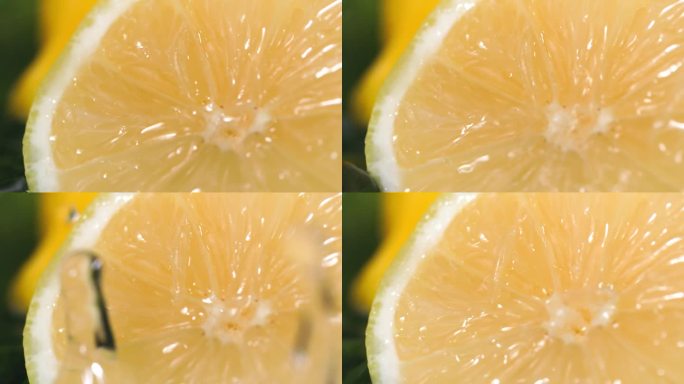 柑橘，多汁的柠檬片倒水在黑暗的背景上，特写
