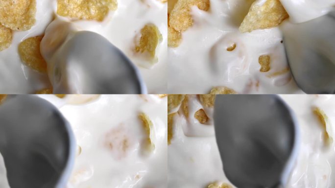 金属勺子混合干全谷物玉米片乳制品酸奶早餐健康食品特写宏观