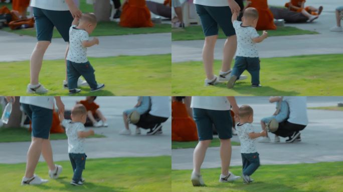 小婴儿蹒跚学步视频母亲牵着小孩学走路