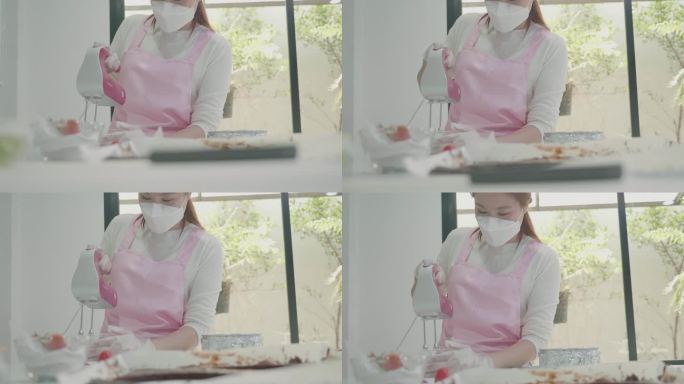 专业厨师正在做蛋糕。现代厨房里，顶上有草莓的白色蛋糕特写