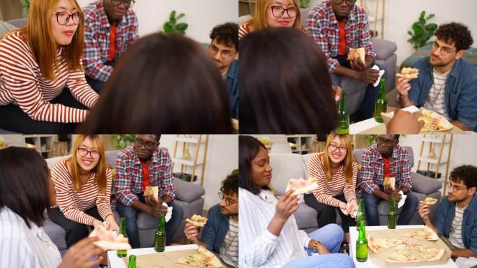 一群不同种族的朋友在家庭聚会上吃着披萨喝着啤酒