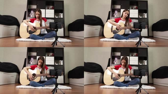 一个女孩为她的博客制作视频内容，展示她的吉他技巧和课程;一个青少年音乐家，用相机捕捉她的吉他练习，为