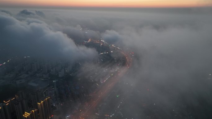 航拍傍晚时分云雾之下的威海市高新区城市