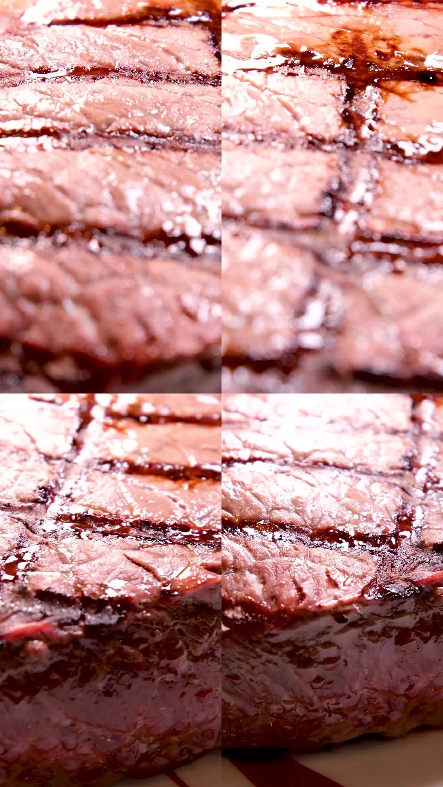 在肉店里，用白色盘子盛着的烤t骨牛排，从上面用缩小效果拍摄。近距离视频剪辑的牛肉片烤与胡椒，迷迭香香