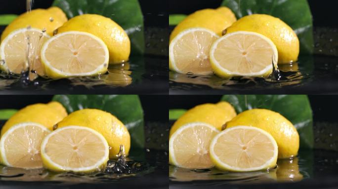 开胃多汁的柠檬切与果肉在黑暗的背景与水溅在慢动作，特写
