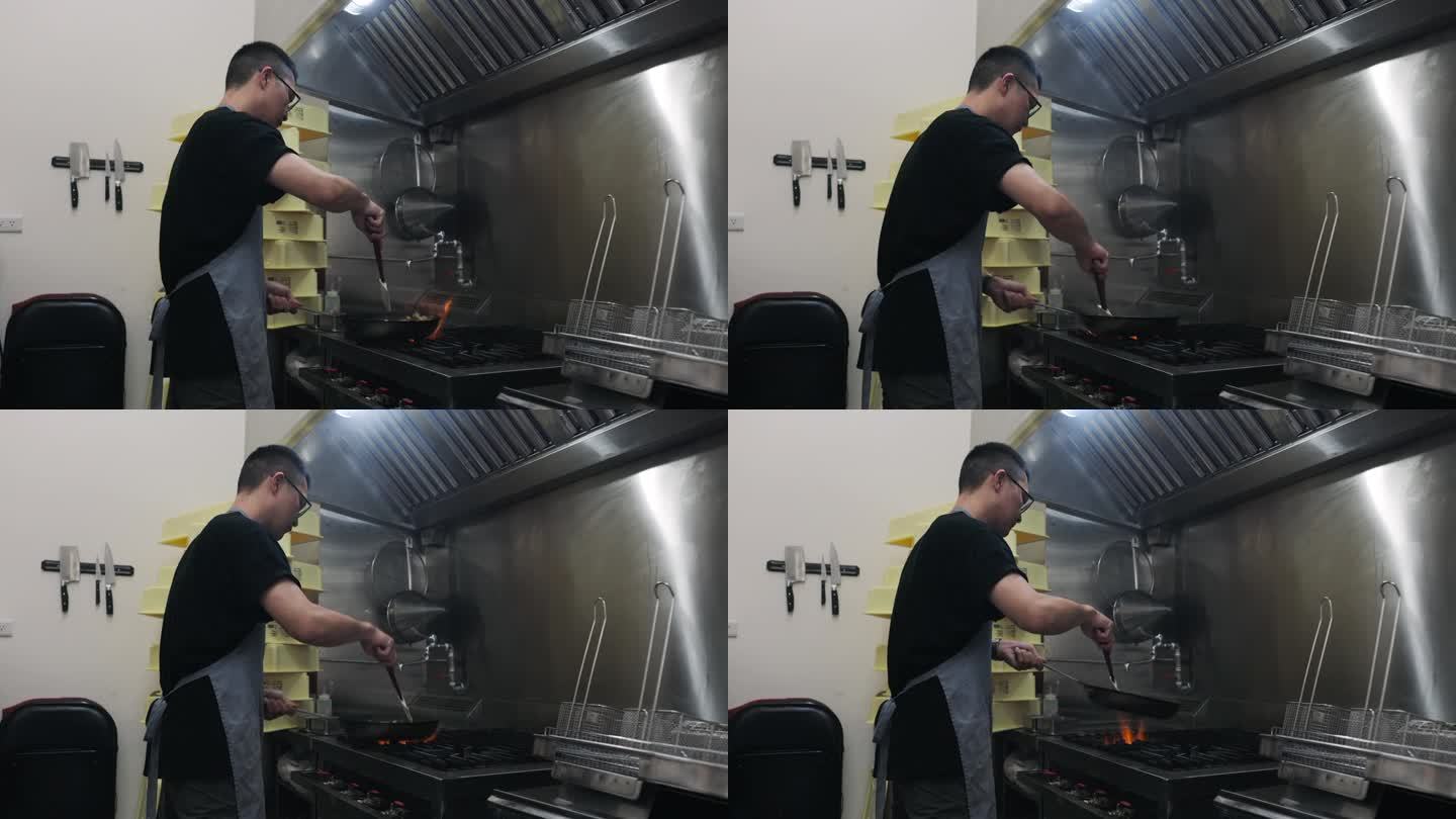 一位亚洲男性餐厅老板在开业前仔细准备食材。在厨房里，他用炒锅炒蔬菜。