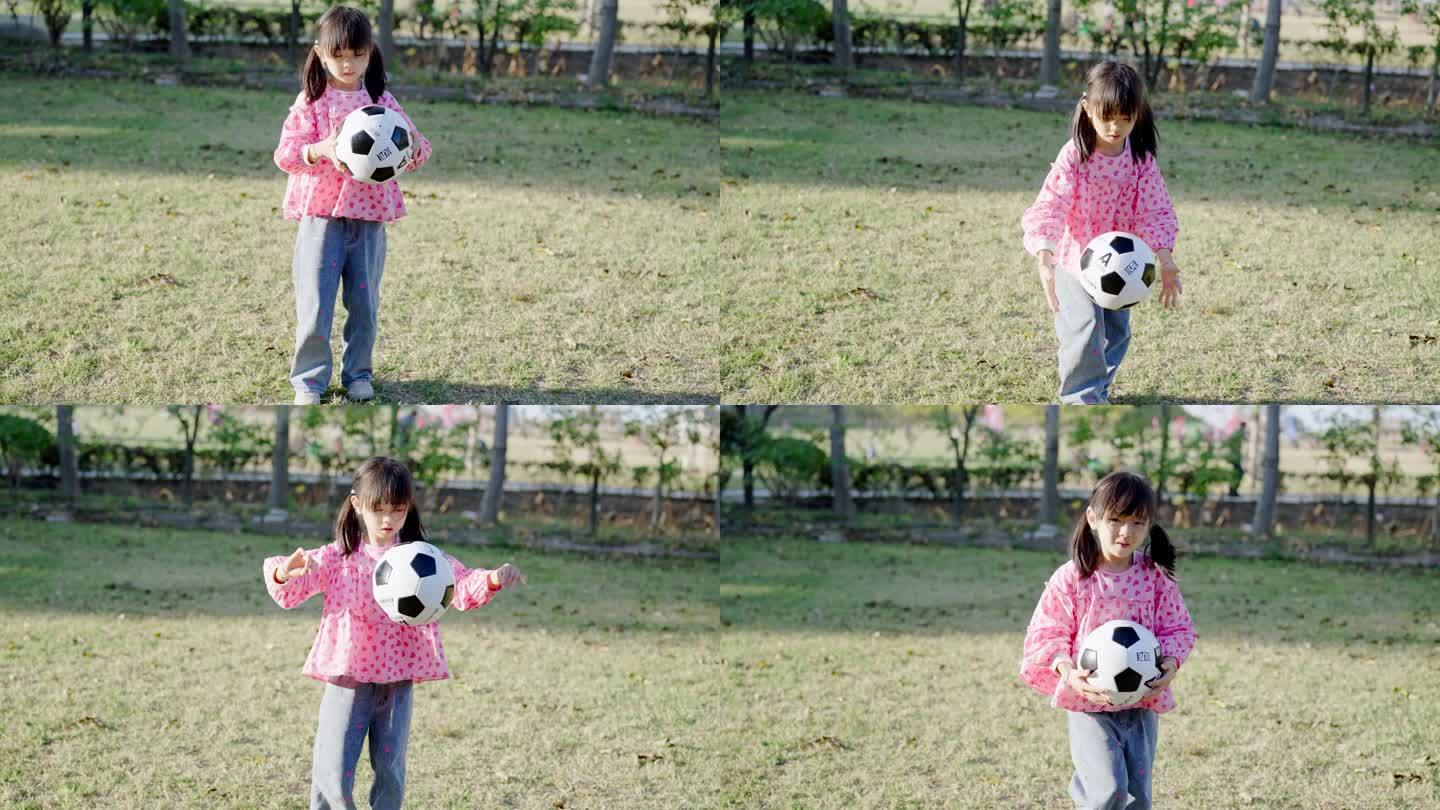 可爱女孩子 户外拍打足球