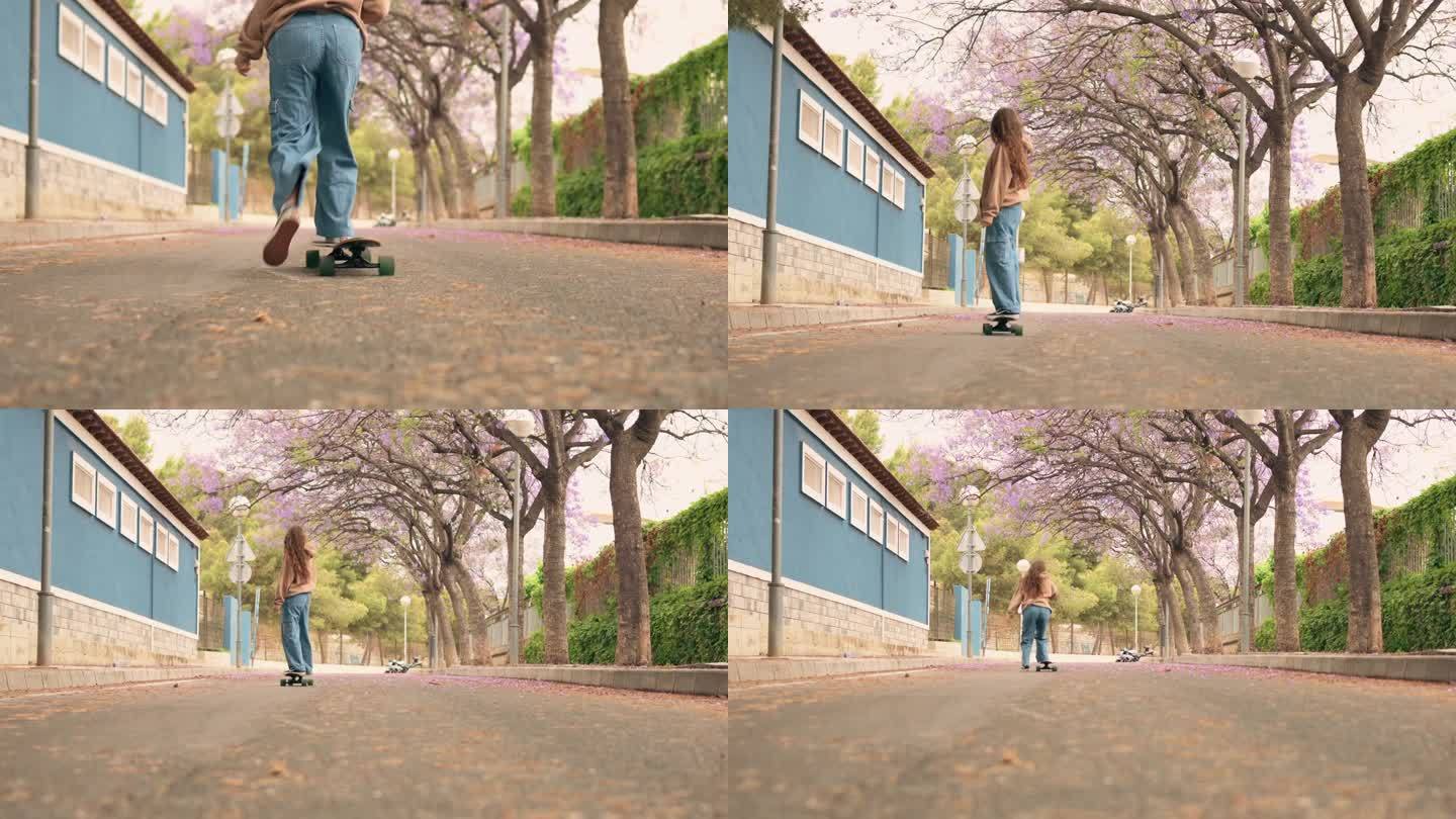 一名年轻女子在街上滑着滑板