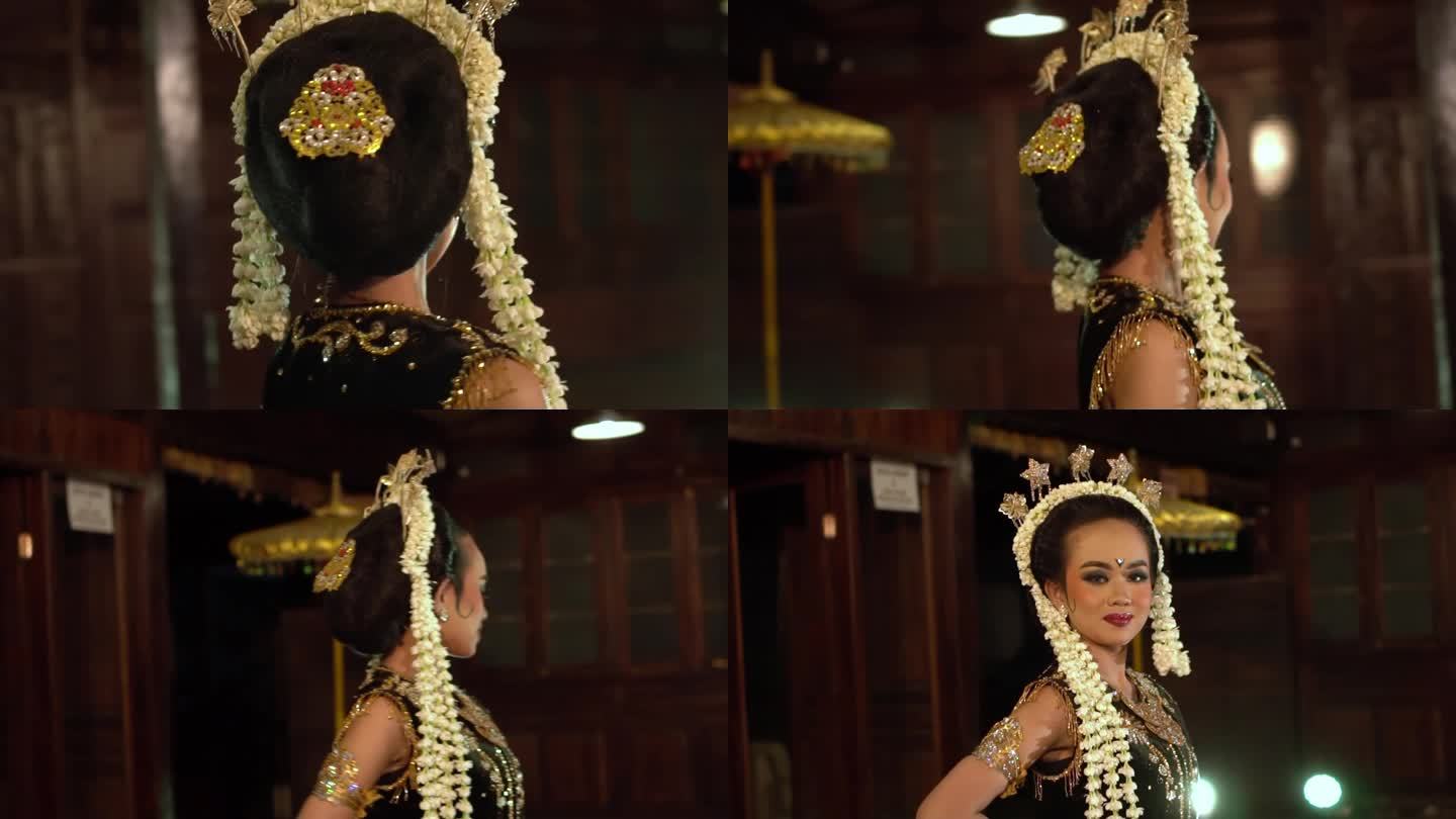 一个穿着传统服装的亚洲舞者摆出非常漂亮的姿势