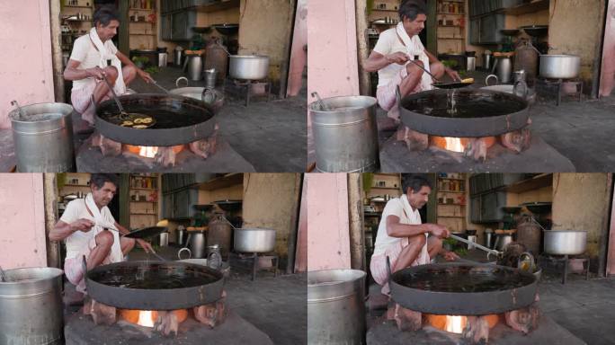 斋浦尔，印度街头小贩正在准备一份甜煎饼