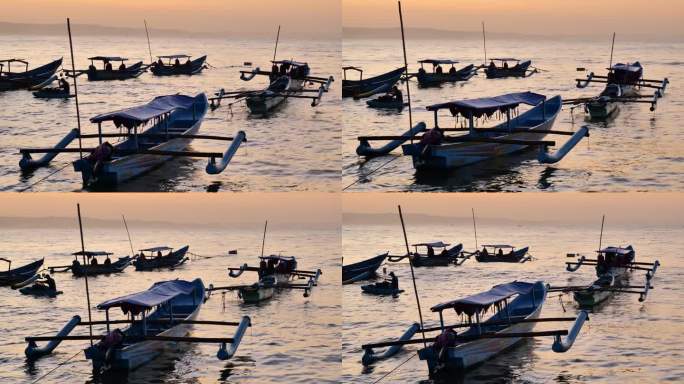 清晨，在日出前的Pangandaran海滩上，渔船停泊在波浪中摇晃，远处有雾和小船。中镜头和手持。