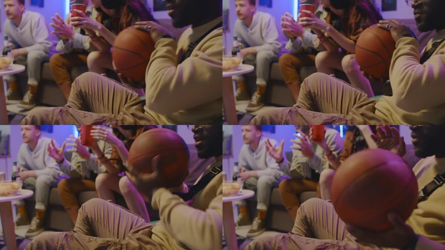 黑人男子与朋友在电视上观看篮球比赛