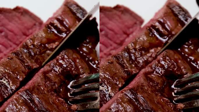 烧烤新鲜的牛肉肉与血牛排提供美味的食物，用刀切几个视频的一个过程，烹饪美味的烧烤牛排