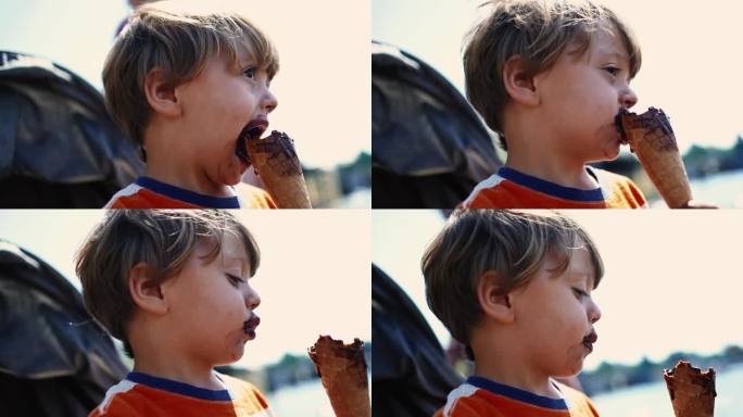 小男孩在吃巧克力甜筒。肖像脸特写的孩子吃糖食物甜点