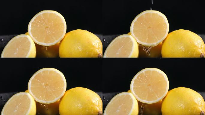 成熟多汁的柠檬，在黑暗的背景上，有水滴和飞溅的水