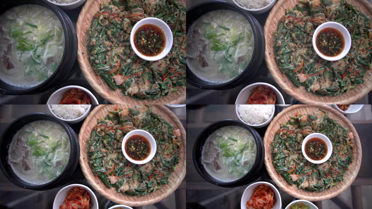 韩式料理海鲜煎饼、牛骨汤配菜、雪龙汤、海葵、巴全盘