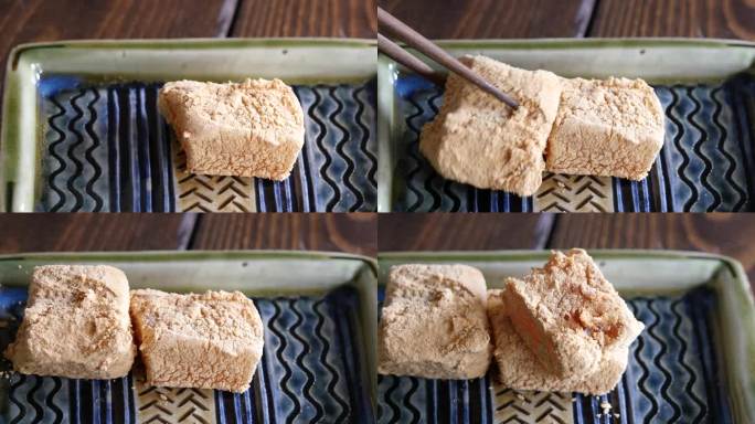 一段覆盖着大豆粉的瓦腊比麻糬视频。