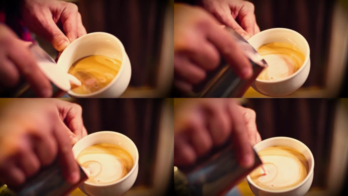 精品咖啡店里的咖啡师在做拉花。专业男士用浓缩咖啡倒流牛奶。咖啡师制作心形的咖啡拉花艺术