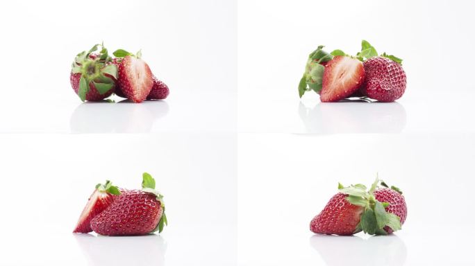三个新鲜的草莓一片旋转在白底循环