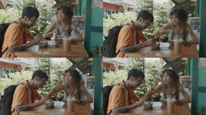 一男一女坐在餐厅前享受美味的泰国甜点和咖啡。