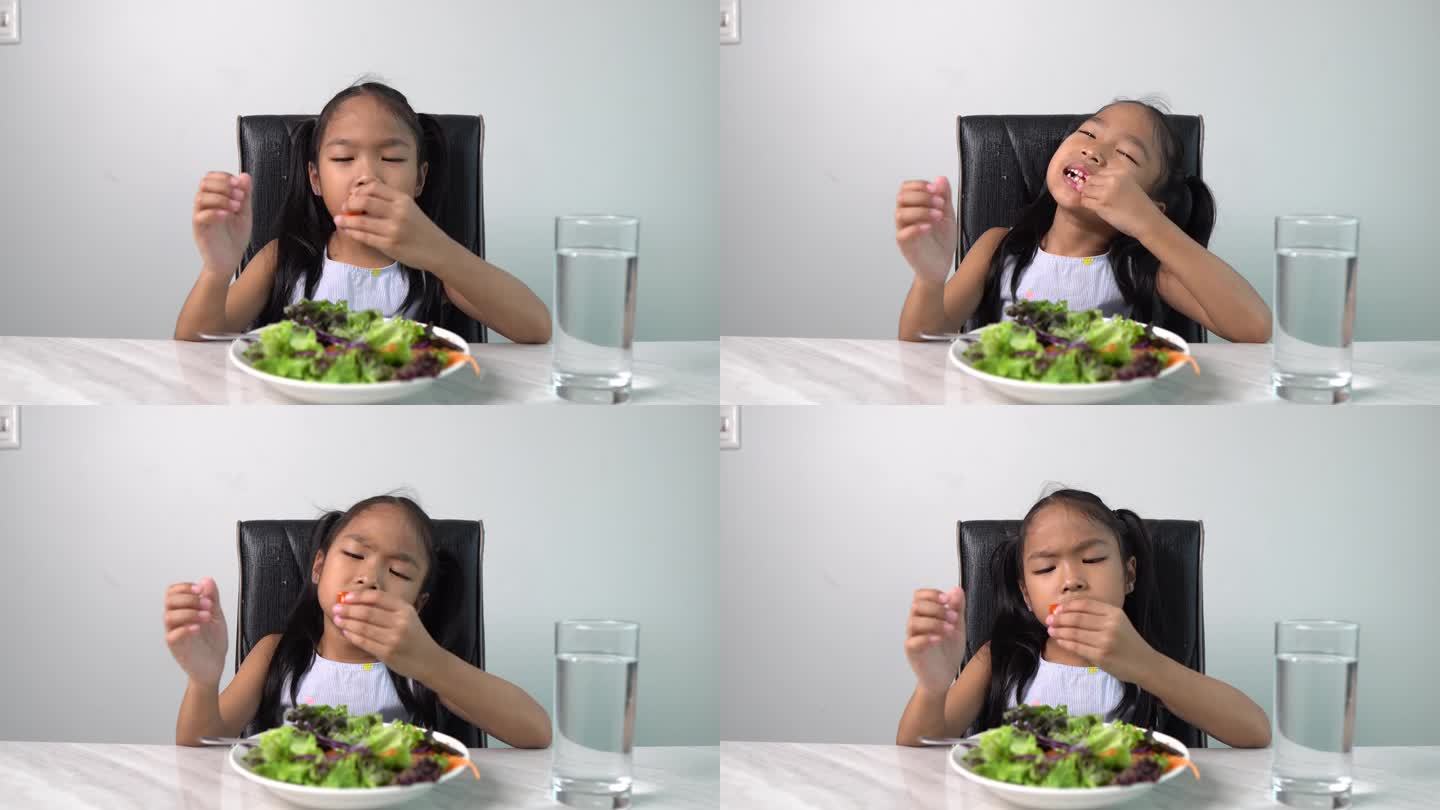 可爱的小女孩拒绝吃健康的蔬菜。