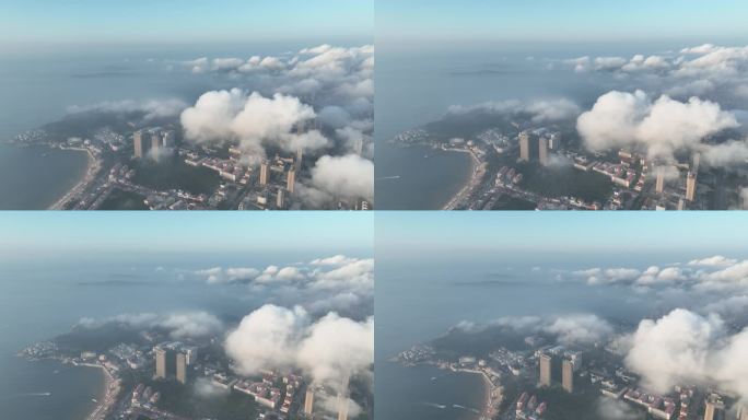 航拍俯瞰白云之下的威海市国际海水浴场