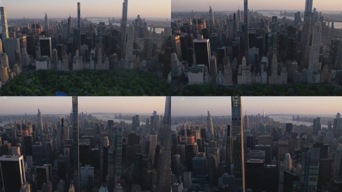 傍晚的纽约，从空中俯瞰中央公园和曼哈顿中城摩天大楼。电影无人机视图的城市天际线与日落和薄云的天空