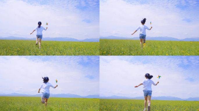 小女孩拿着风车奔跑在田野上