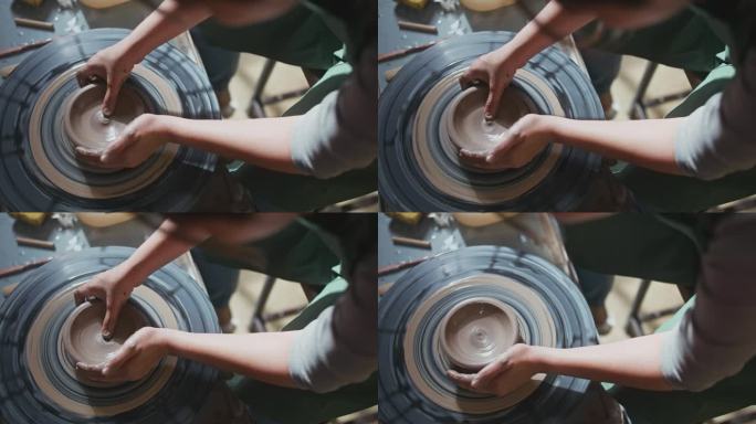 传统陶器制作，妇女陶工的手塑造一个碗
