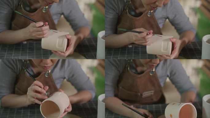 年轻女子在她的陶器作坊里制作手工陶瓷，小生意的概念