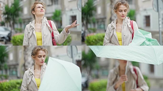 年轻女子在街上打着伞开始下雨