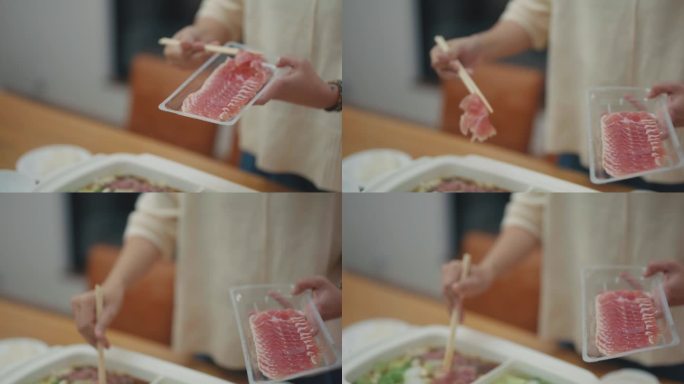亚洲人用筷子夹着猪肉片夹在有烟熏的火锅上，喜欢吃涮肉。大旅行，小预算