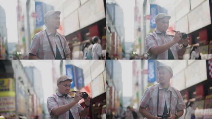 亚洲男性游客在东京市内观光、散步、观光，并享受拍照。