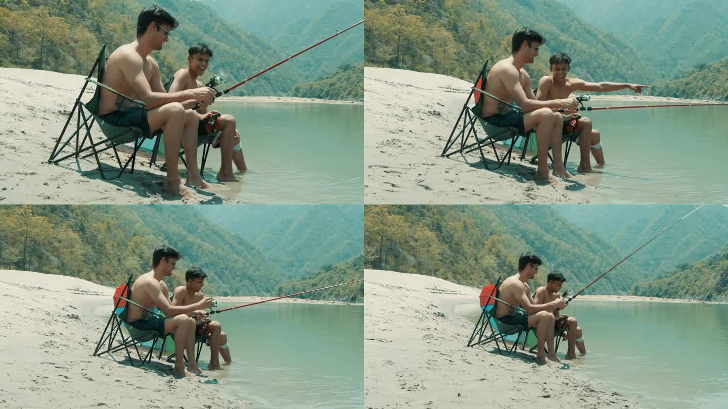 光膀子的游客坐在折叠椅上在湖里钓鱼