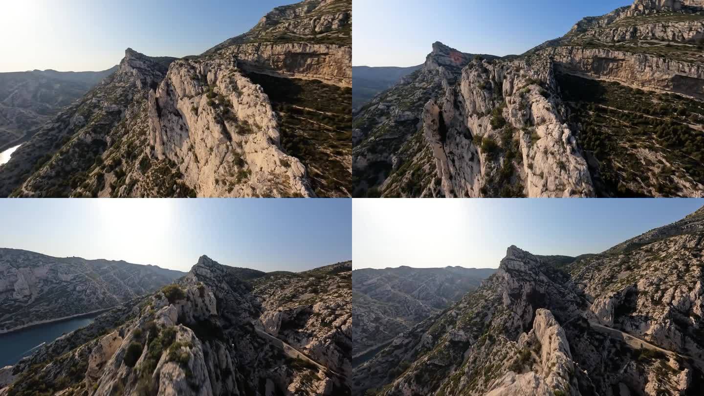 FPV比赛无人机航拍视频飞越悬崖的calanque(或calanche)地貌在法国。