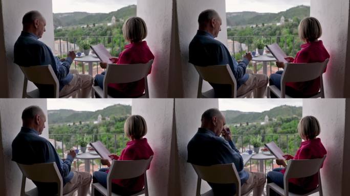 老夫妇在阳台上放松，喝着咖啡