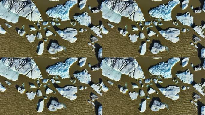 冰山漂浮棕色冰川泻湖变暖气候蓝色冰抽象航空