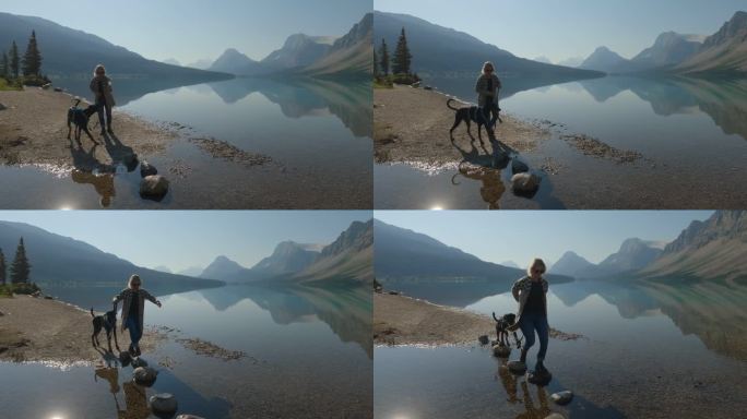 一个女人在湖边遛狗