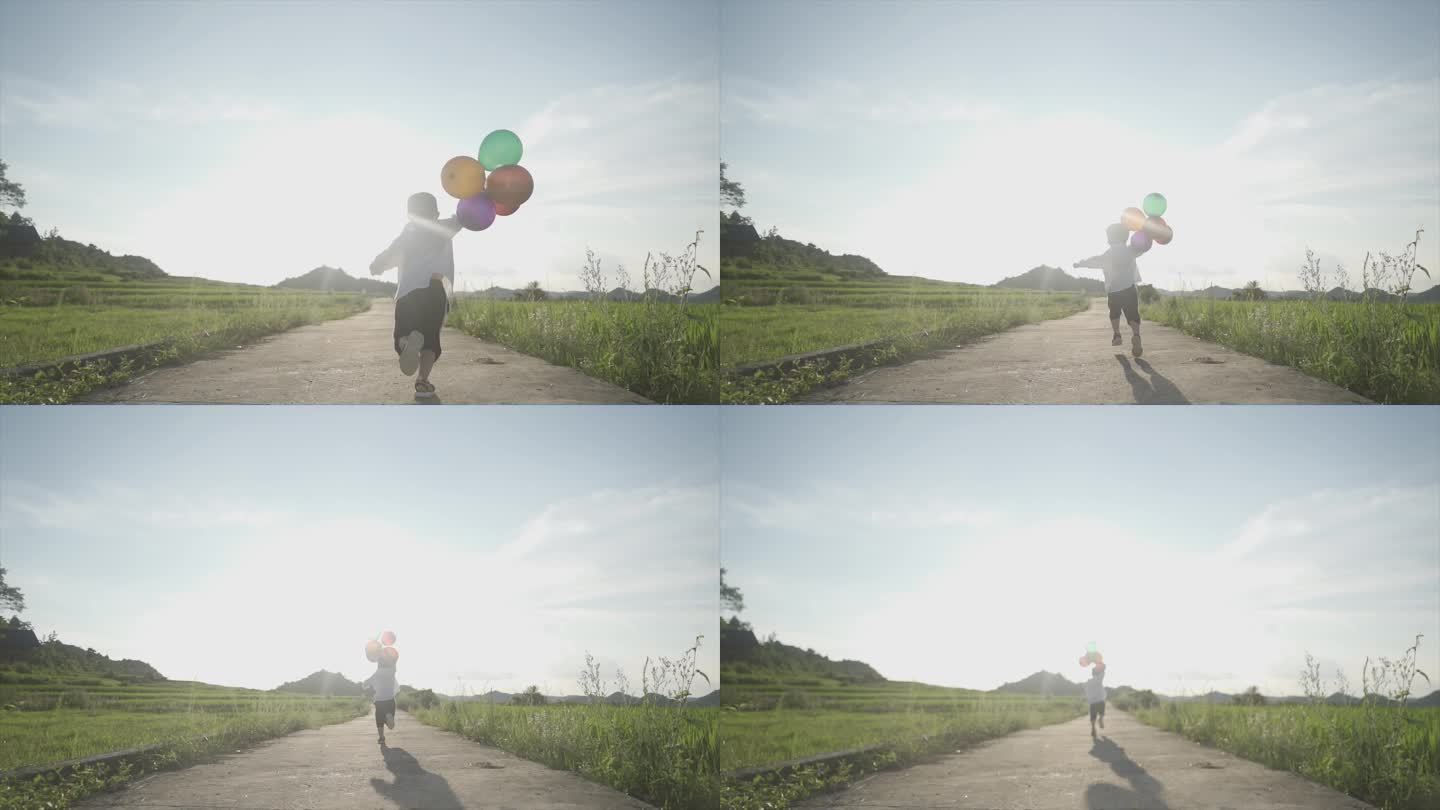 小男孩拿着气球奔跑背影欢乐童年自由自在