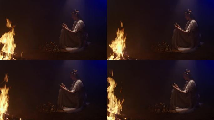 女娲娘娘在篝火旁挑选泥人