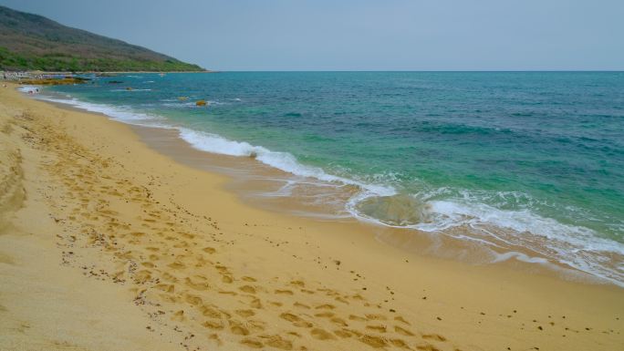 阴天 海边 沙滩 脚印 足迹 海浪