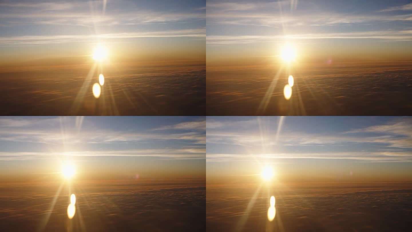 明亮的黄色太阳在傍晚日落前从飞机窗口观看。