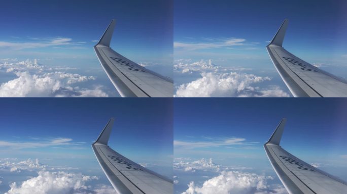 航空飞机在云层之上窗外蓝天白云