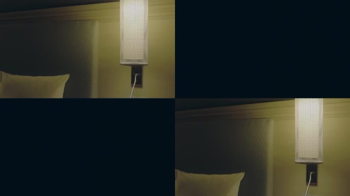 卧室里打开台灯的特写。