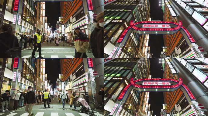 日本人，亚洲游客晚上走在东京新宿歌舞伎町红灯区的街道上。日本旅游景点，旅游地标，亚洲夜生活，城市生活
