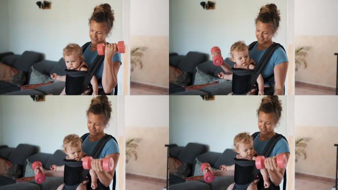 一名妇女在家里做健身运动，而婴儿则放在胸前