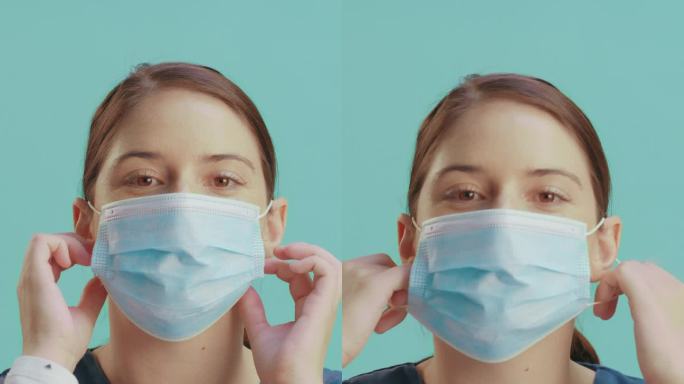 戴口罩的女性、面部或护士在演播室背景下摘下口罩，用于医疗保健、健康和防细菌。微笑、快乐或医生在医院诊