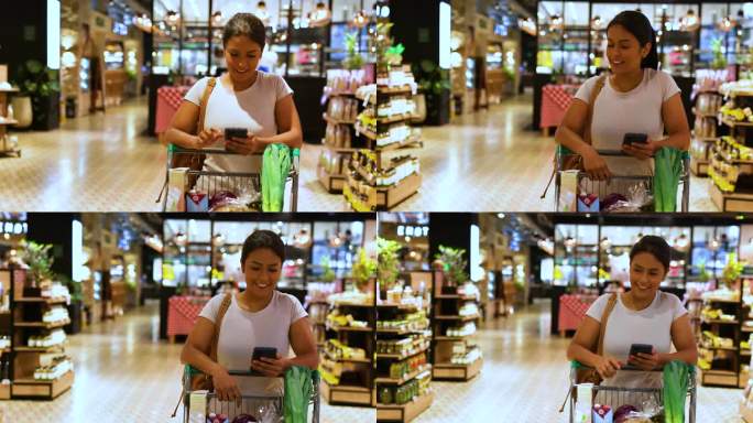 一名拉丁美洲妇女在超市按照手机上的购物清单买东西，看起来很开心